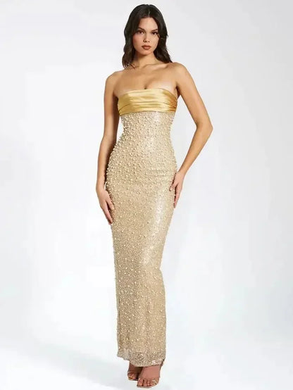 Vestido largo dorado con brillo sin tirantes y escote recto