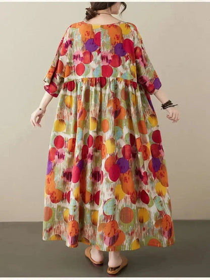 Vestido largo de mujer amplio con estampado artístico y mangas a media manga