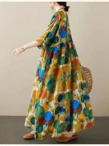 Vestido largo de mujer amplio con estampado artístico y mangas a media manga