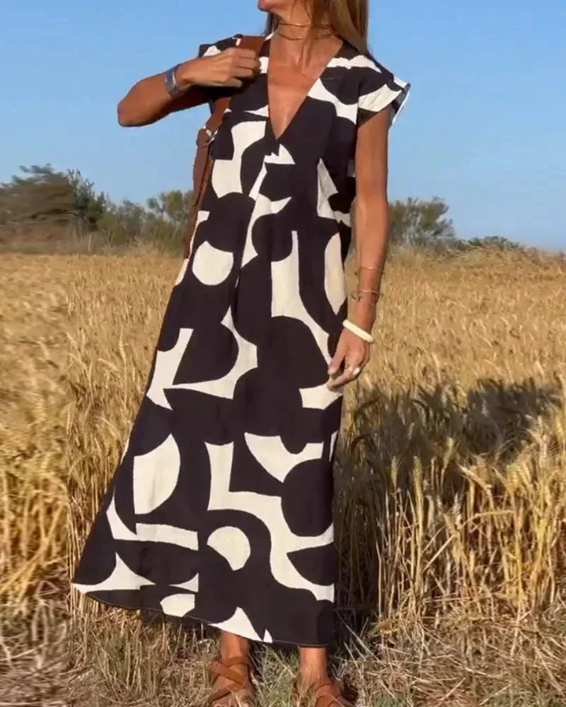Vestido largo mujer con cuello en V y motivos fluidos