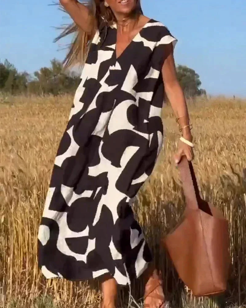 Vestido largo mujer con cuello en V y motivos fluidos