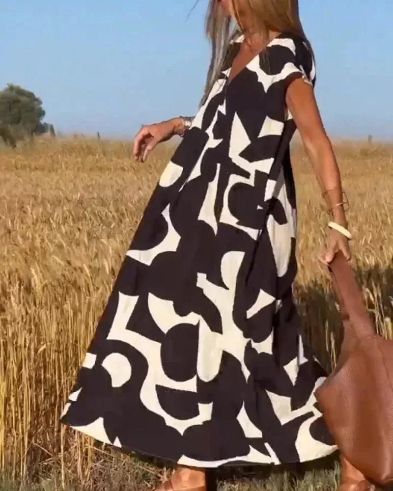 Vestido largo mujer con cuello en V y motivos fluidos
