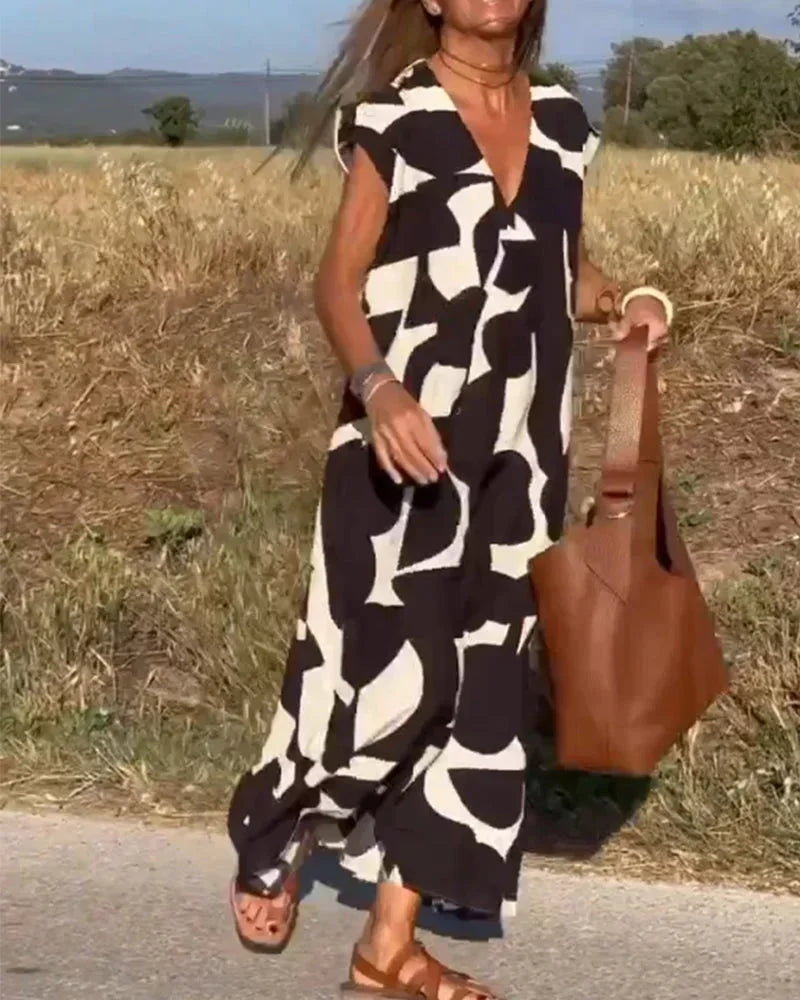 Vestido largo mujer con cuello en V y motivos fluidos