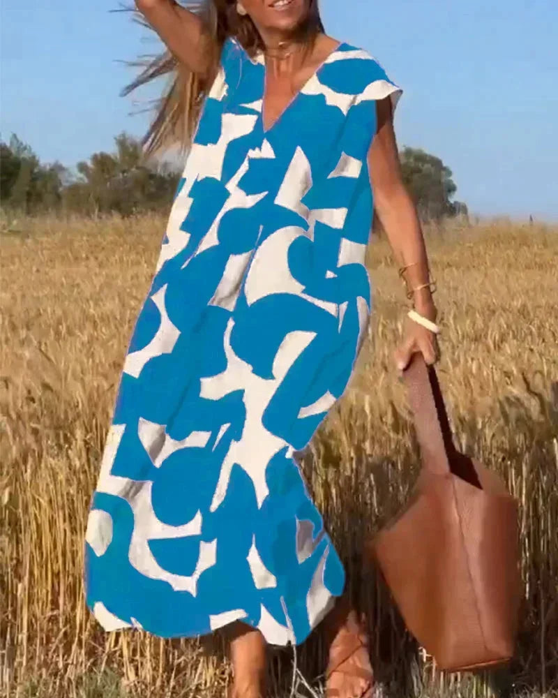 Vestido largo mujer con cuello en V y motivos fluidos