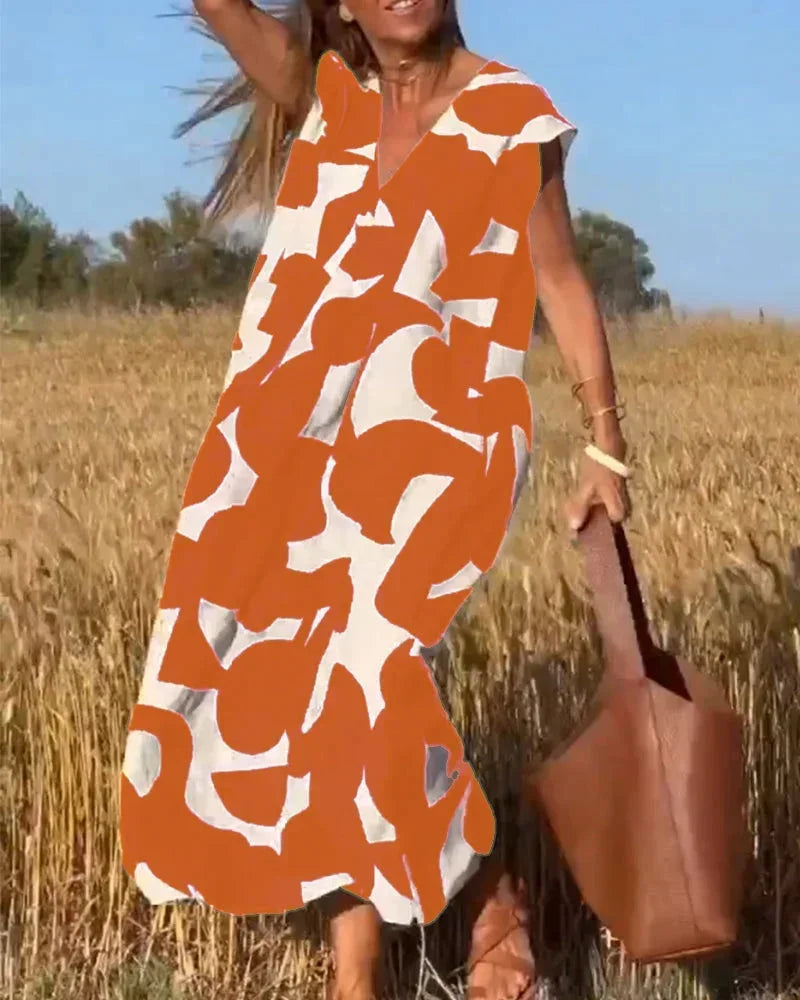 Vestido largo mujer con cuello en V y motivos fluidos