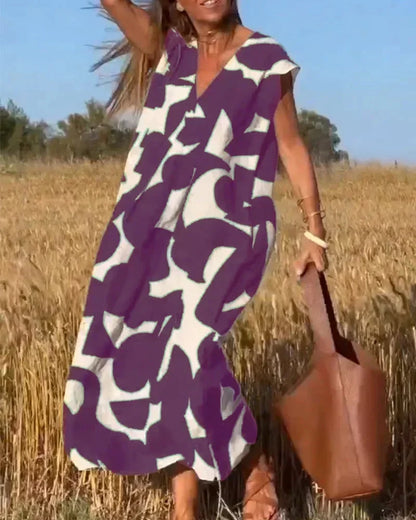 Vestido largo mujer con cuello en V y motivos fluidos