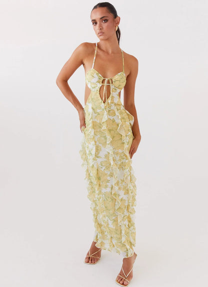 Vestido largo con volantes y estampado floral amarillo