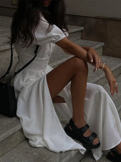 Vestido largo entallado con botones y mangas abullonadas