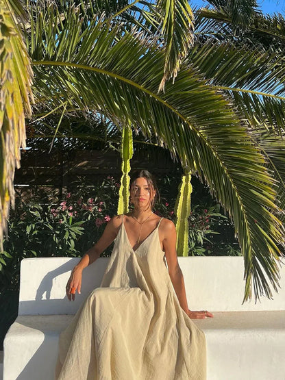 Vestido largo fluido de mujer con tirantes finos y volantes