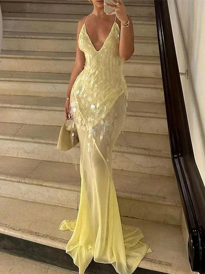 Vestido largo amarillo con lentejuelas espalda cruzada escote en V